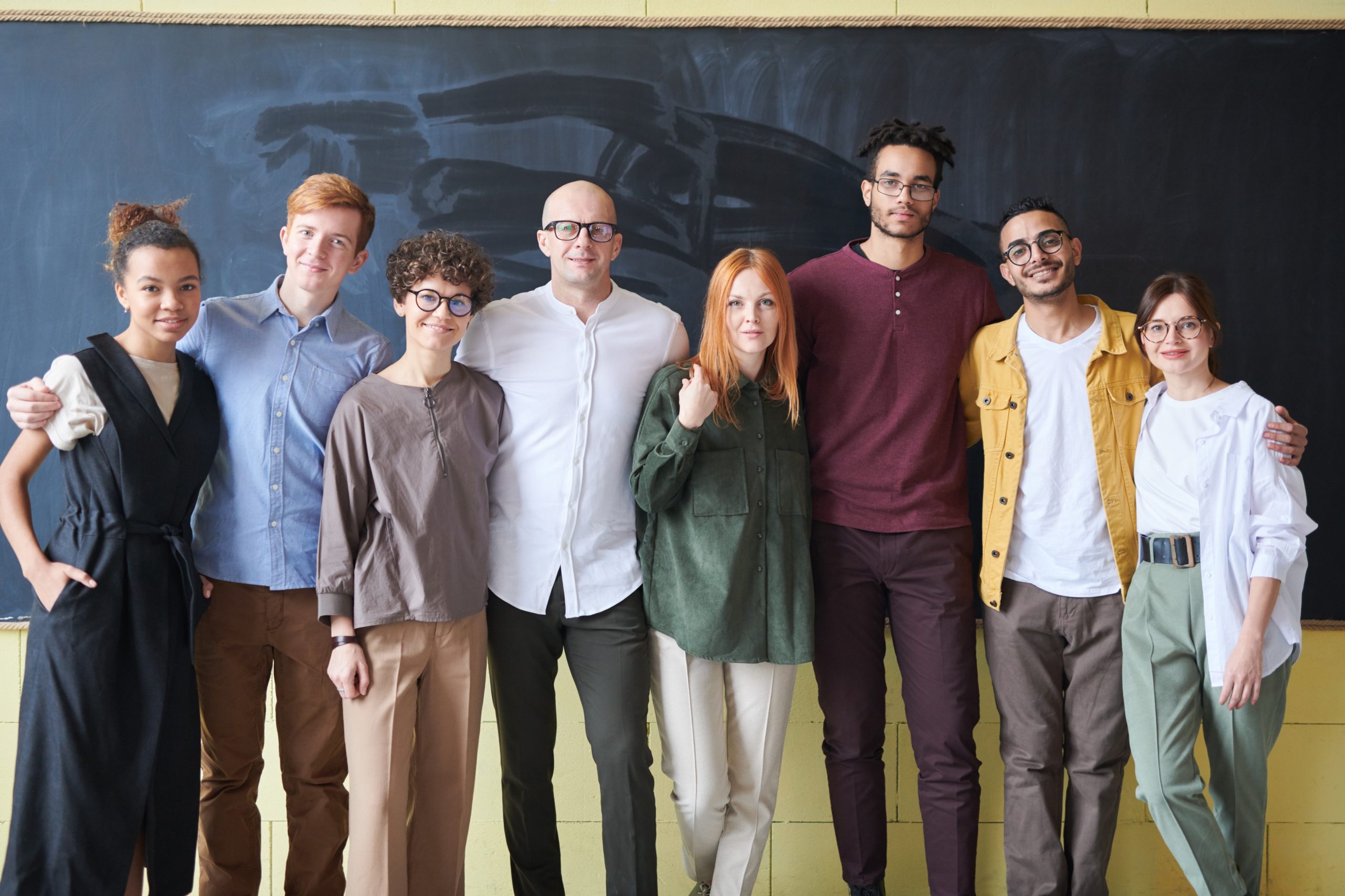 photo-of-people-standing-near-blackboard-3184393